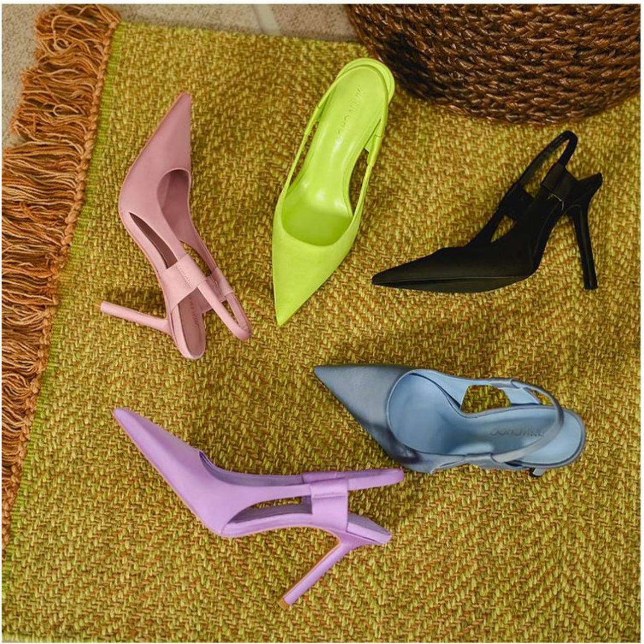 Top view of high heels footwear on an isolated yellow pastel background.  Fashion concept, catwalk. Online